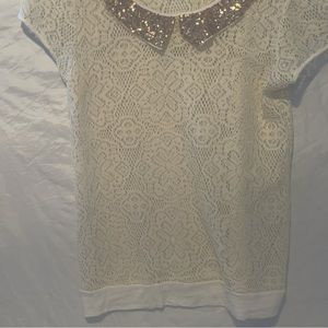 Fun lacy shirt with gold glittery collar.